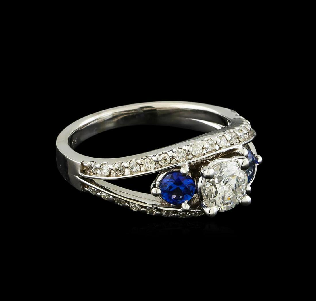 0.95 ctw Diamond and Sapphire Ring - 14KT White Gold: One electronically tested 14KT white gold lady's cast wedding ring with a split shank with a bright polish finish. The featured lady's ring has a shank measuring 2.38 millimeters wide. Identified with