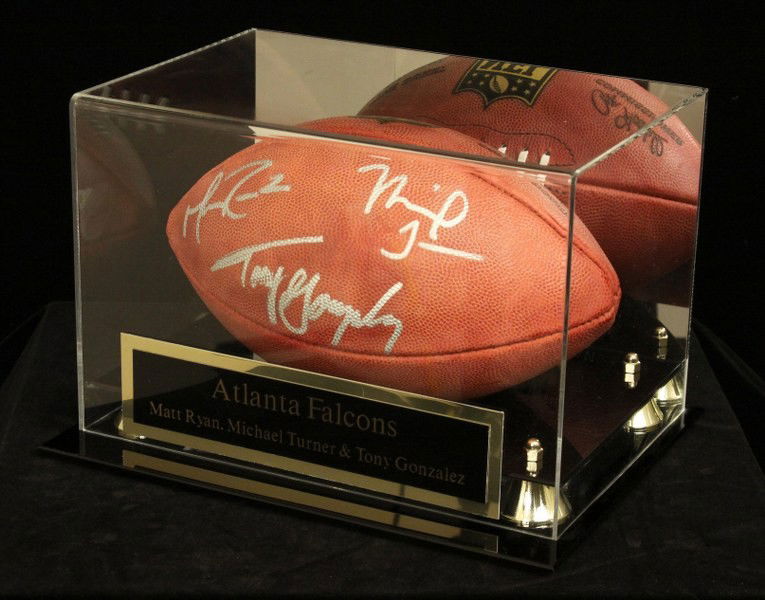 Three Atlanta Falcons Signed Football SM6: "Three Atlanta Falcons Signed Football SM6. Excellent Condition! FA151TG. This football is signed by Atlanta Falcons Matt Ryan, Michael Turner, and Tony Gonzalez. Comes with display case and plaque an