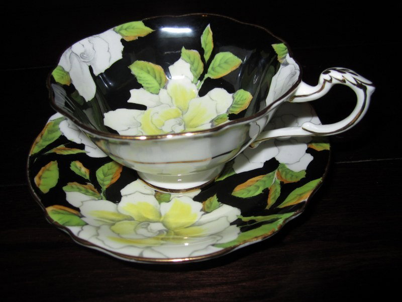 Paragon China- Beautiful Chintz Daisy Cup & Saucer Set : "Paragon China- Beautiful Chintz Daisy Cup & Saucer Set BD75. Excellent Vintage Condition! WT14PT. This wonderful set has a bold chintz design of yellow & white Roses on a black background. The set lo