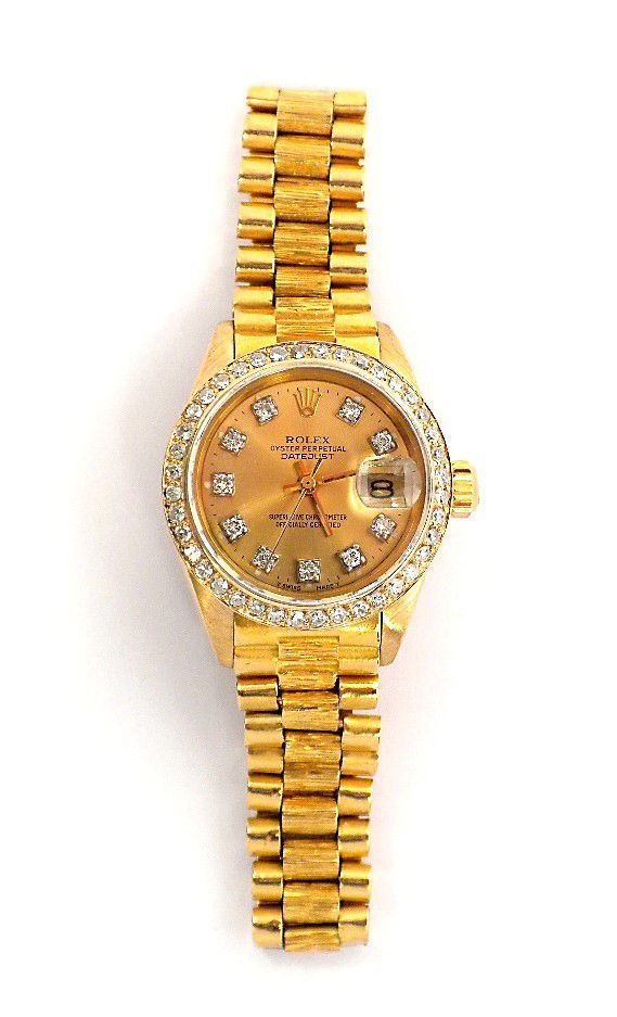 Ladies 18KT Gold Rolex Diamond DateJust Watch A2784: "Ladies 18KT Gold Rolex Diamond DateJust Watch A2784. Excellent Condition! QZ1004XZ. One ladies, hand crafted and machine milled Rolex DateJust model the Lady President wristwatch electronically teste