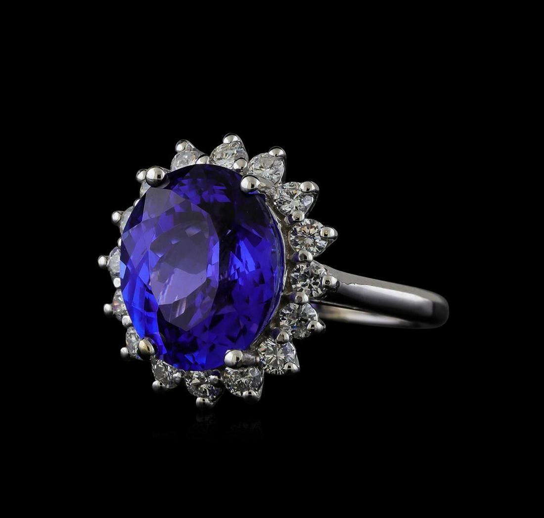 8.04 ctw Tanzanite and Diamond Ring - 14KT White Gold: One electronically tested 14KT white gold lady's cast fashion ring with a basket halo with a bright polish finish. The featured lady's ring has a shank measuring 1.95 millimeters wide. Identified with