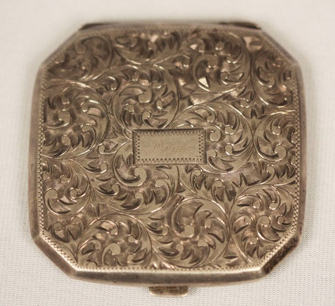 Vintage Sterling Compact BD51: "Vintage Sterling Compact BD51. Great condition! PA141CK. Wonderful 1920's chased sterling compact, has mirror and loose powder and puff. Great vintage condition. Engraved "Dixie" very lightly. Valued