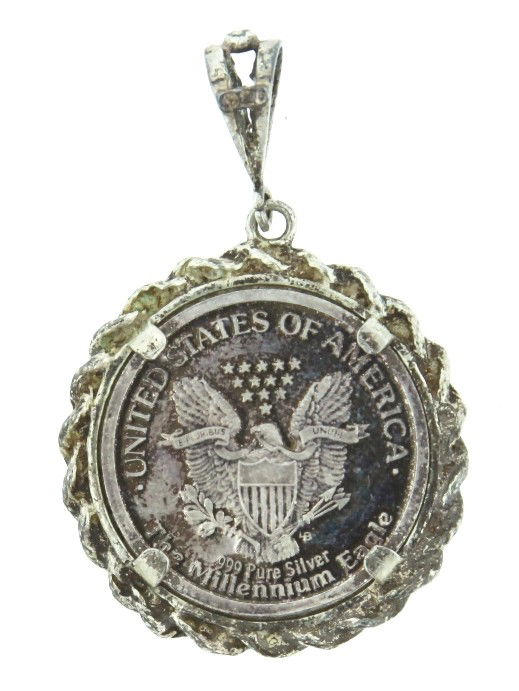 2000 Millennium Eagle Commemorative Bezel Set Medal WBS: "2000 Millennium Eagle Commemorative Bezel Set Medal WBS12. As Is Condition! CT31NL. This commemorative medal is approximately 8.5 grams of .999 and .925 silver. Thank you for viewing this lot. We are