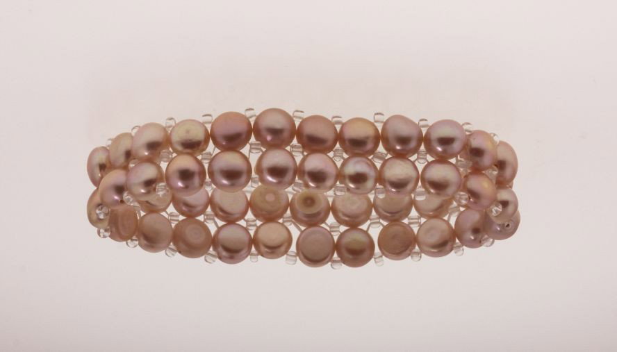 6.5" Cultured Champagne Pink Pearl Bracelet PS47: "6.5" Cultured Champagne Pink Pearl Bracelet PS47. Excellent Condition! HG3QG. One approx. 6.5" champagne colored cultured pearl bracelet. Stretches for adjusting to different sizes of wrists, with 2 