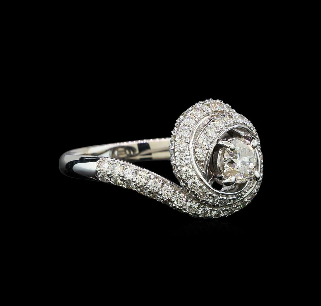 1.70 ctw Diamond Ring - 14KT White Gold: One electronically tested 14KT white gold lady's cast wedding ring with a bypass swirl halo with a bright polish finish. The featured lady's ring has a shank measuring 2.51 millimeters wide. Identifie