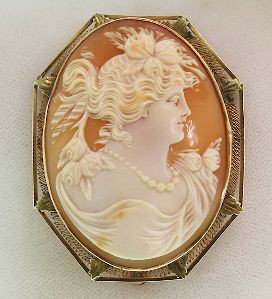 10K Gold Art Noveau "Flora" Shell Cameo Brooch. ED378: "10K Gold Art Noveau "Flora" Shell Cameo Brooch. ED378 Excellent Vintage Condition! VC201NH. Ca 1910. A beautiful shell cameo depicting Flora, the Goddess of Spring. She has flowers in her unswept hai