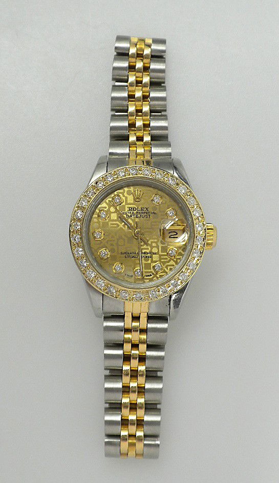 Lady Rolex Two-Tone DateJust Wristwatch 0.65ct A2552: "Lady Rolex Two-Tone DateJust Wristwatch 0.65ct A2552. Excellent Condition! LX1091QL. One ladies hand crafted & machine milled Rolex DateJust Model Stainless Steel and 18KT yellow gold wristwatch elec