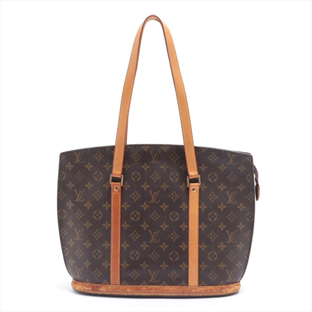 Louis Vuitton Brown Monogram Canvas Leather Babylone Tote Bag: Brown and tan monogram coated canvas Louis Vuitton Babylone tote with brass hardware, tan vachetta leather trim, dual flat shoulder straps, beige Alcantara lining, dual pockets at interior walls; one 