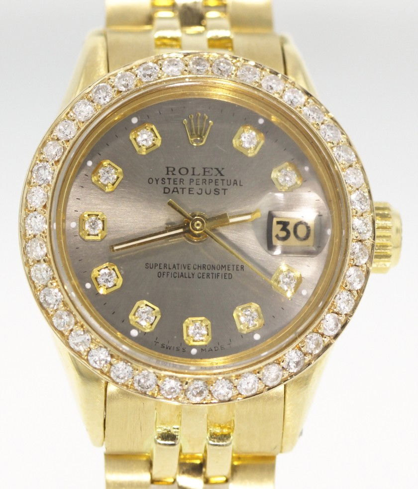 Ladies 18KT Gold Rolex Diamond DateJust Wristwatch A321: "Ladies 18KT Gold Rolex Diamond DateJust Wristwatch A3218. Great Condition! YA3373HE. One ladies, hand crafted and machine milled Rolex DateJust model the Lady President wristwatch electronically test