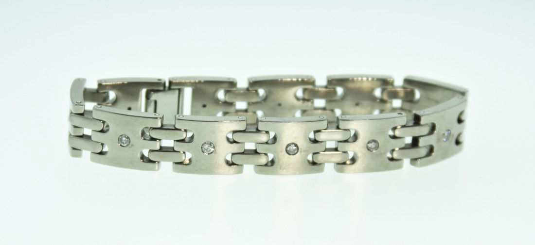 Abo Titanium & Diamond Bracelet 1.28ct ED1068: "Abo Titanium & Diamond Bracelet 1.28ct ED1068. Great Condition! DT101CZ. One titanium and diamond bracelet made by Abo. Measures 8" long and has 1.28ct of diamonds inlaid the titanium. Fold over styl