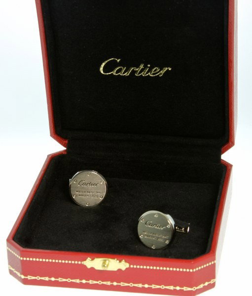 Cartier Sterling Silver Cuff Links ED1070: "Cartier Sterling Silver Cuff Links ED1070. Great Condition! CL181CD. One pair of Cartier sterling silver palladium finished cuff links. Comes with Certificate certifying this water resistant pair is