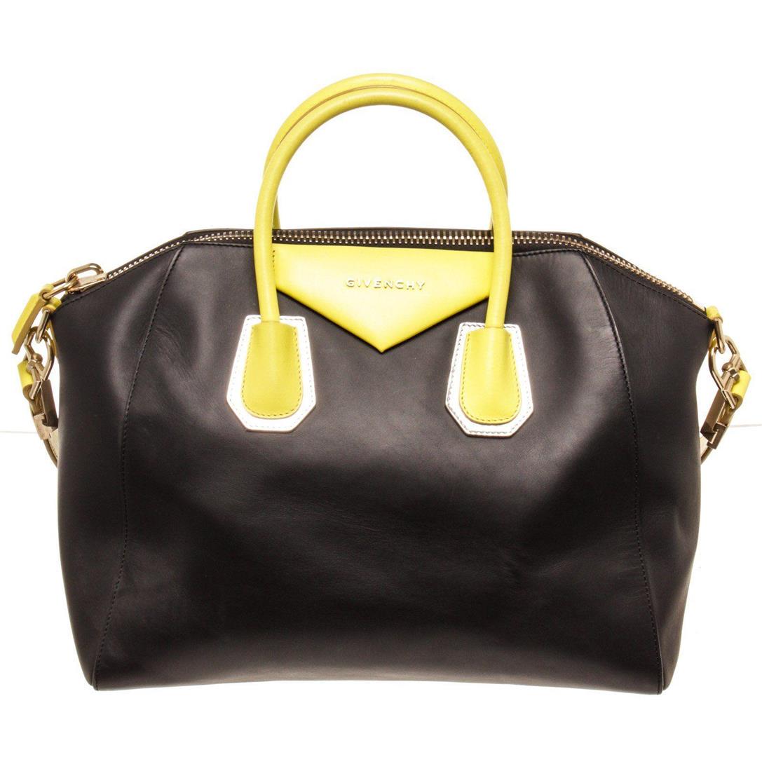 Givenchy Black Leather Medium Antigona Satchel Bag: Givenchy Black Leather Medium Antigona Satchel Bag with leather, silver-tone hardware, black canvas lining, two interior slip pockets, interior zip pocket, optional leather shoulder strap, and zip top