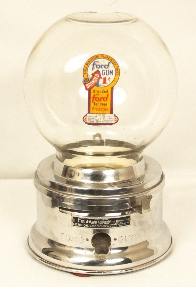 Vintage Ford "1 Cent" Gumball Machine BD216: "Vintage Ford "1 Cent" Gumball Machine BD216. Good Condition! AL611WS. This is a RARE stainless steel "1-cent" Ford gumball machine in good condition. There is a chip on the top of the glass, however 