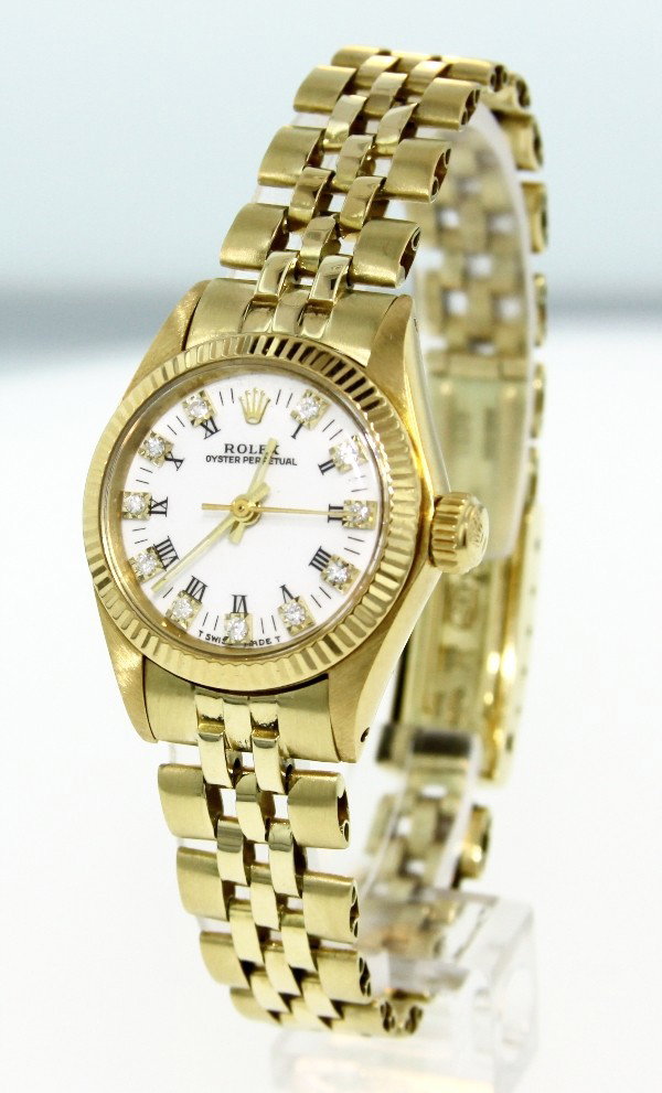 Vintage 14KT Gold Rolex Oyster Perpetual Wristwatch A31: "Vintage 14KT Gold Rolex Oyster Perpetual Wristwatch A3117. Good Condition! IF6682FE. One ladies, hand crafted & machine milled Vintage Rolex Oyster Perpetual model wristwatch electronically tested 14