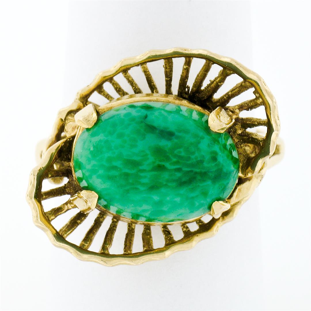 Vintage Handmade 18k Yellow Gold Oval Jade Solitaire Ring: A vintage handmade 18k yellow gold ring featuring an oval cabochon cut natural green jade (13.9x10.0mm). The ring is size 8, weighs a total of 7.59 grams, and measures 18.5mm wide.