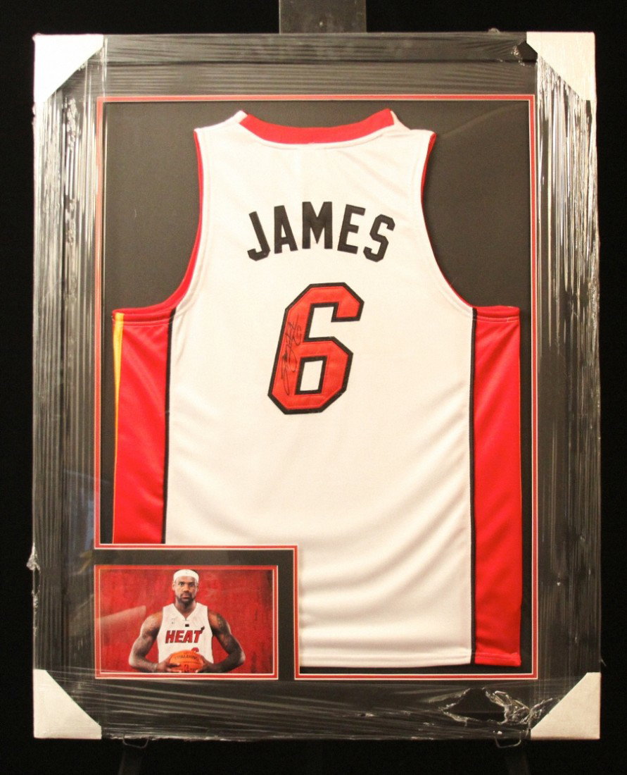LeBron James Miami Heat Autographed Jersey SM11: "LeBron James Miami Heat Autographed Jersey SM11. As-Is Condition! PD104VL. One framed Miami Heat jersey autographed by LeBron James, #6. Comes with a certificate of authenticity. Thank you for viewin