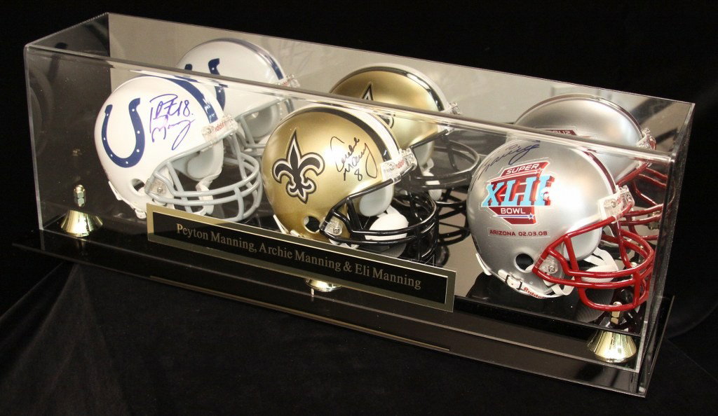 Three Manning Autographed Mini Helmets SM8: "Three Manning Autographed Mini Helmets SM8. Excellent Condition! NM151YZ. These three mini helmets are signed by Payton Manning, Archie Manning, and Eli Manning. Comes with display case and plaque an