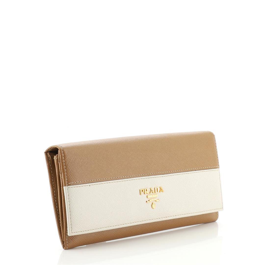 Prada Continental Wallet Saffiano Leather Long: Prada Continental Wallet Saffiano Leather Long. Wear on exterior corners, wear, darkening and small marks on flap trim. Moderate splitting on opening corners, scratches, discoloration and tarnish on h