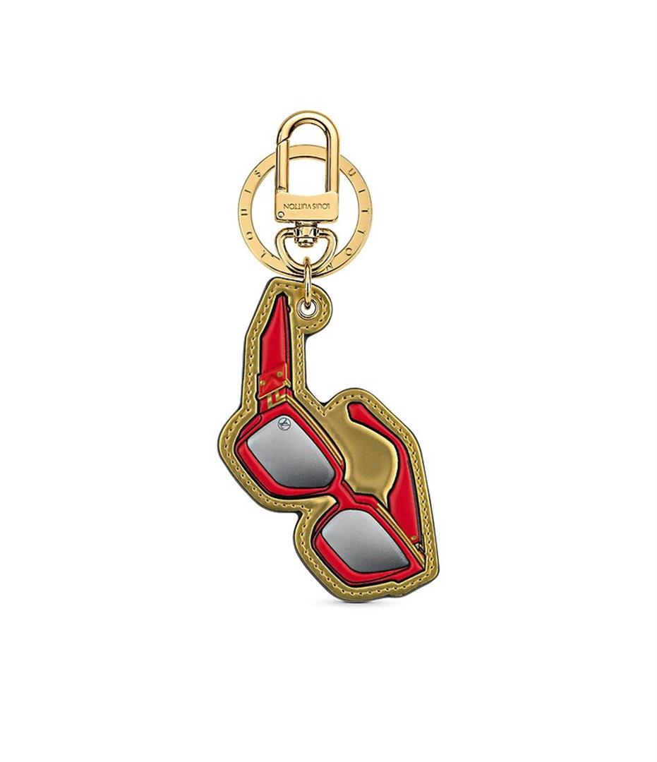 Louis Vuitton Gold-tone Printed Leather and Monogram Canvas 1.1 Millionaire Mini: The 1.1 Millionaire Mini Icons bag charm and key holder by Virgil Abloh's design hearken back to Al Capone's old Chicago, with vintage Monogram sunglasses in embossed cowhide leather. This versatile p