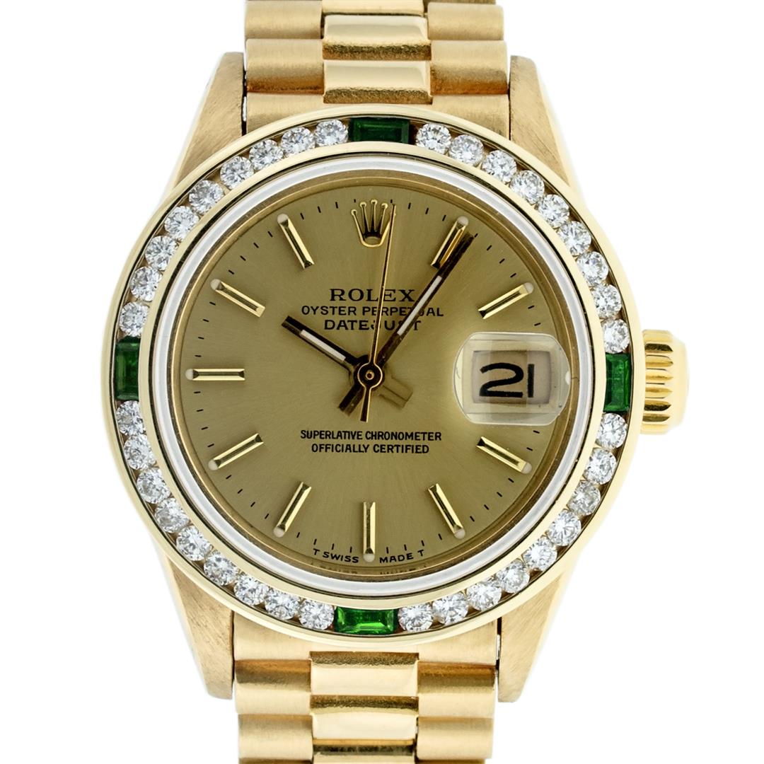 Rolex Ladies 18K Yellow Gold Emerald And Champagne Index President Wristwatch Wi: One Ladies 18K Yellow Gold Rolex President Polished, Serviced & Electronically Tested, Yellow Gold Case: 26mm, 18K Yellow Gold Crown, Custom Bezel: New 18K Yellow Gold Emerald Channel Set Diamond Beze