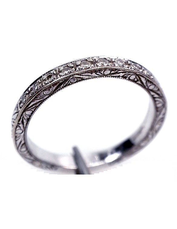 18KT White Gold Diamond Wedding Band 0.14ct A2584: 18KT White Gold Diamond Wedding Band 0.14ct A2584. Good Condition! JA611LX. One electronically tested 18KT white gold ladies cast diamond wedding band. Bright and patterned finish with milgrain detail