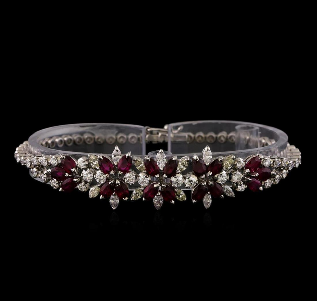 3.96 ctw Ruby and Diamond Bracelet - 18KT White Gold: One electronically tested 18KT white gold ladies cast & assembled ruby and diamond bracelet. Seven inch length bracelet features a series of ruby and diamond florets transitioning into flexible diamon