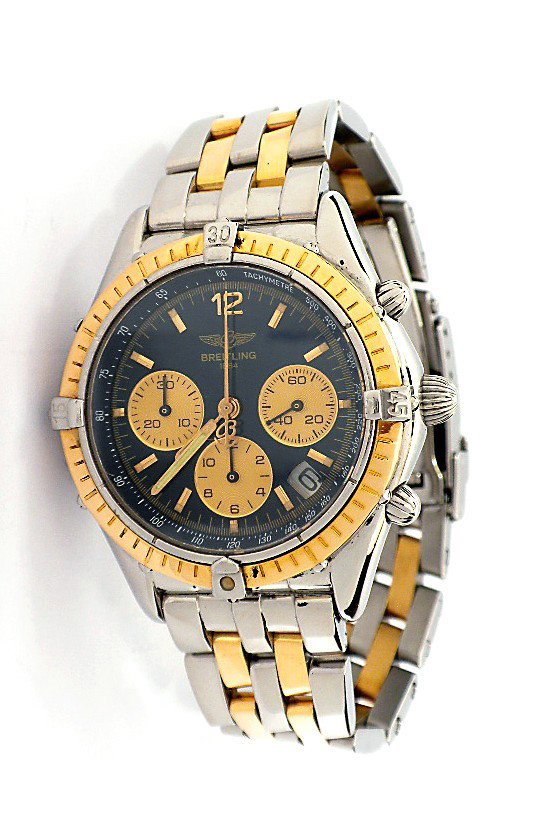 Breitling Gents Windrider Chrono Cockpit Wristwatch WBS: Breitling Gents Windrider Chrono Cockpit Wristwatch WBS56. Great Condition! ZE1052BK. One stainless steel and 18KT gold Breitling Gents Windrider Chrono Cockpit Wristwatch. Condition: G-8 mint. Featur