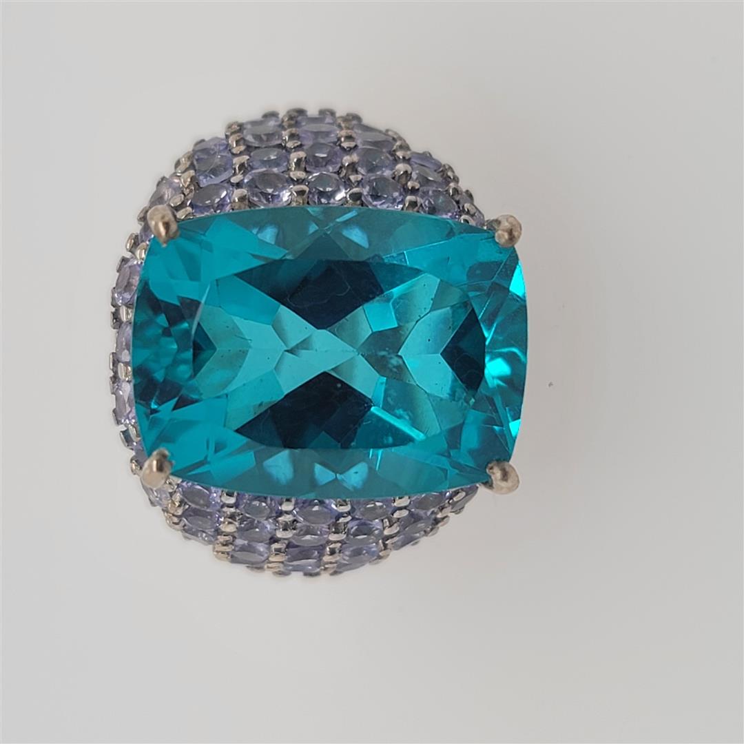Sterling Silver Ring: One Sterling Silver Ring. The ring size is 9.25. Contains semiprecious stones.