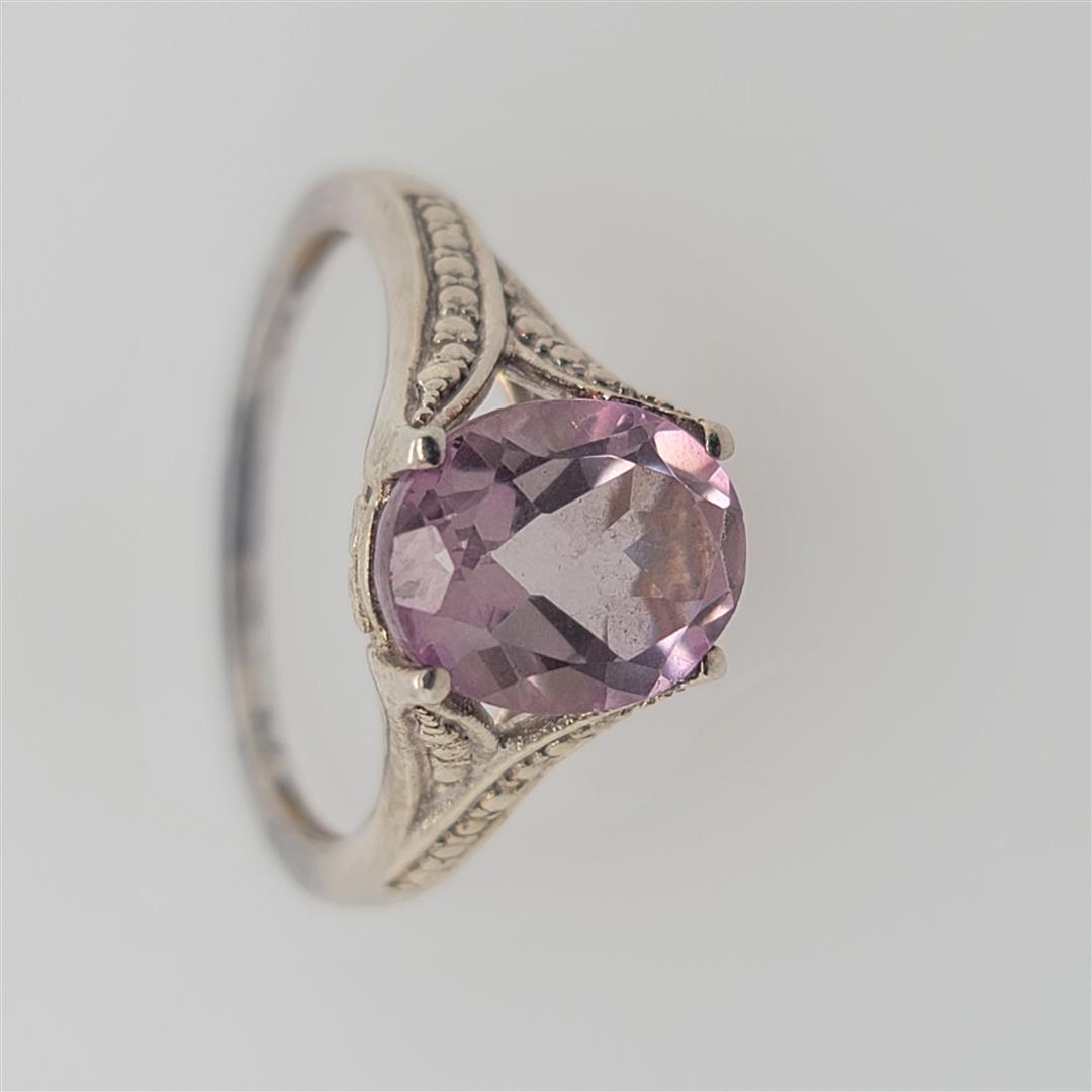 Sterling Silver Ring: One Sterling Silver Ring. The ring size is 8.5. Contains semiprecious stones.