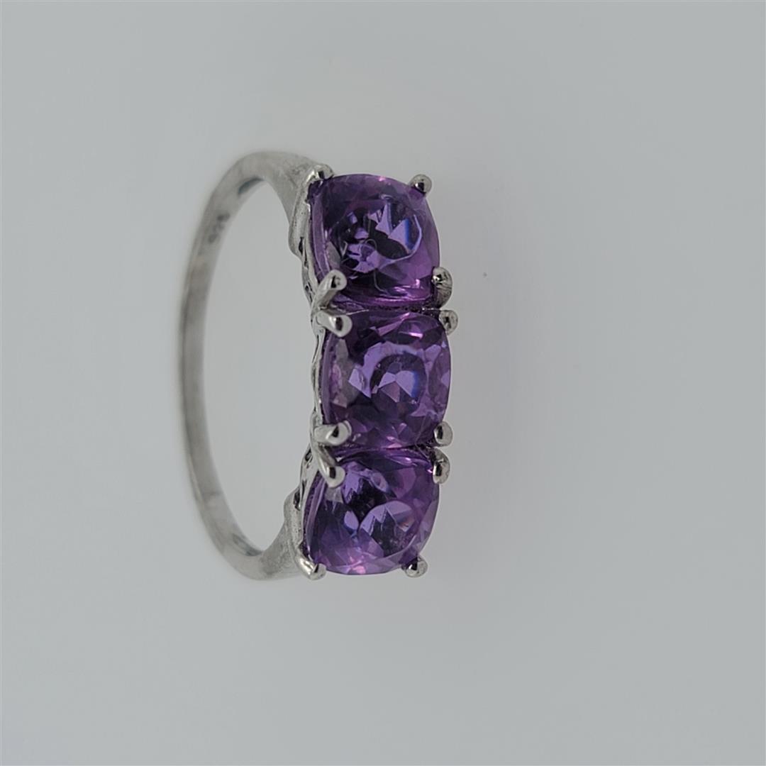 Sterling Silver Ring: One Sterling Silver Ring. The ring size is 8.25. Contains semiprecious stones.