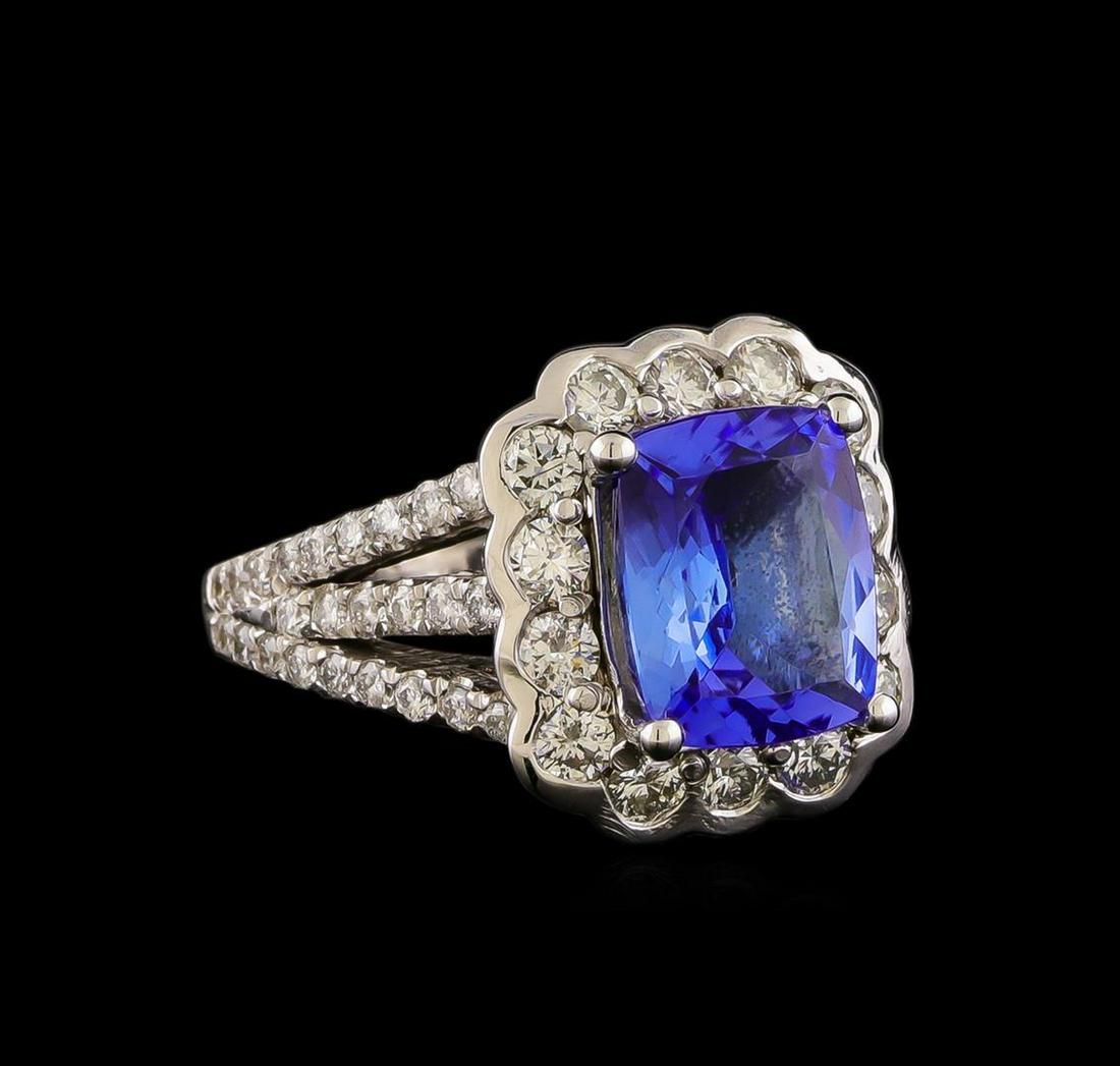 14KT White Gold 3.21 ctw Tanzanite and Diamond Ring: One electronically tested 14KT white gold ladies combination cast & assembled tanzanite and diamond ring with a bright polish finish. Identified with markings of "14K". Condition is new. Containing: O