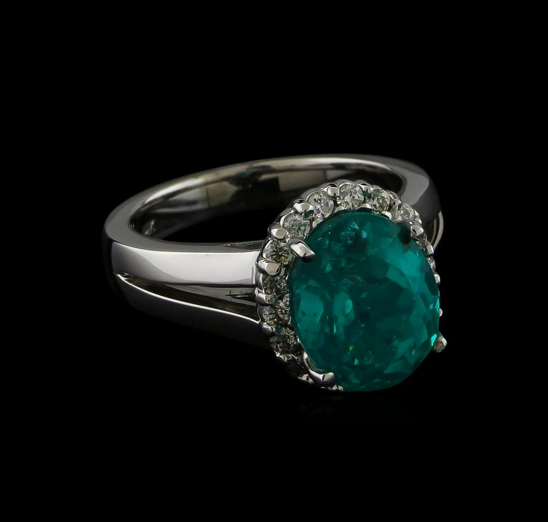 5.12 ctw Apatite and Diamond Ring - 14KT White Gold: One Ring featuring: 14KT White Gold weighing 7.5 grams containing one Apatite center stone with a total weight of 5.12ct and Diamonds with a total weight of 0.33ct.