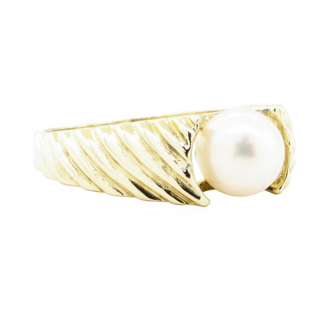 7mm Cultured Pearl Ring - 14KT Yellow Gold: One ring with a hand finished, grooved pattern tapered shank featuring: 14KT yellow gold weighing 2.9 grams containing one pearl measuring 7mm.