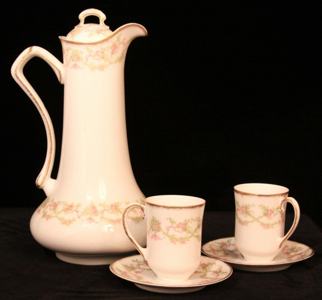 Antique Limoges Chocolate Set ED1135: "Antique Limoges Chocolate Set ED1135. Great Condition! SM101EC. Antique "Old Abbey" Limoges Chocolate Set. Set includes Chocolate Pot and 2 Chocolate Cups with matching saucers. No chips, cracks or d