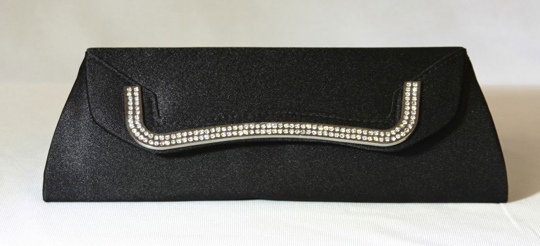Sleek Black Rhinestone Evening Purse RTB70: Sleek Black Rhinestone Evening Purse RTB70. Great Condition! QA7SN. One sleek black and rhinestone purse measuring 4 tall X 10.5" X 2" width. Accented with a wave of rhinestones this purse comes with