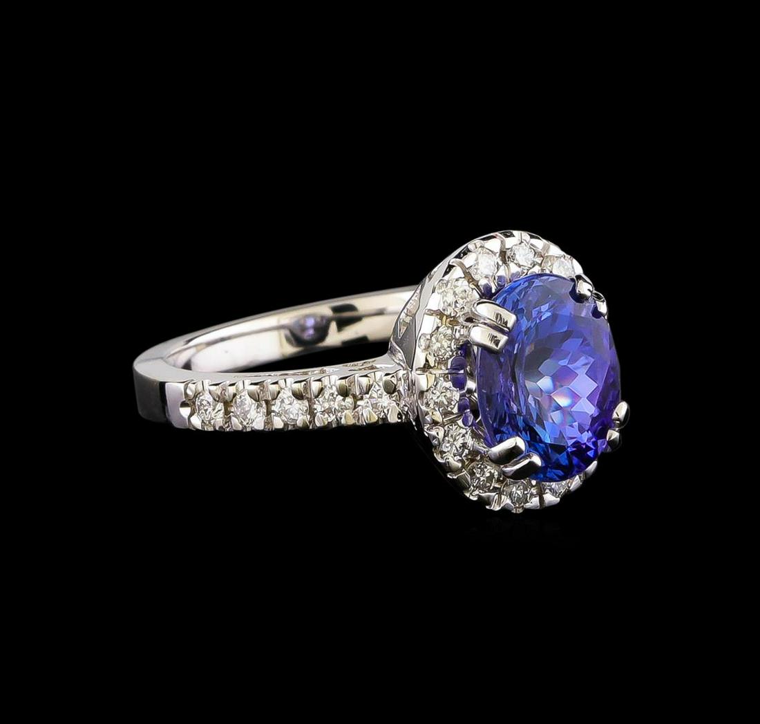 14KT White Gold 2.95 ctw Tanzanite and Diamond Ring: One electronically tested 14KT white gold ladies combination cast & assembled tanzanite and diamond ring with a flat shank with a bright polish finish. Identified with markings of "14K". Condition is 
