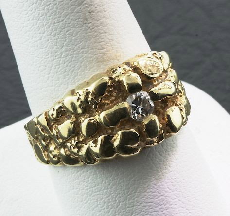 14KT Yellow Gold Diamond Solitaire Nugget Ring A2799: 14KT Yellow Gold Diamond Solitaire Nugget Ring A2799. Good Condition! One electronically tested 14KT yellow gold cast diamond solitaire nugget ring with a bright and patterned nugget finish. Identifie