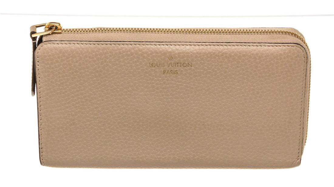 Louis Vuitton Beige Taurillon Leather Porte Cornet Wallet: One Louis Vuitton Beige Taurillon Leather Porte Cornet Wallet.