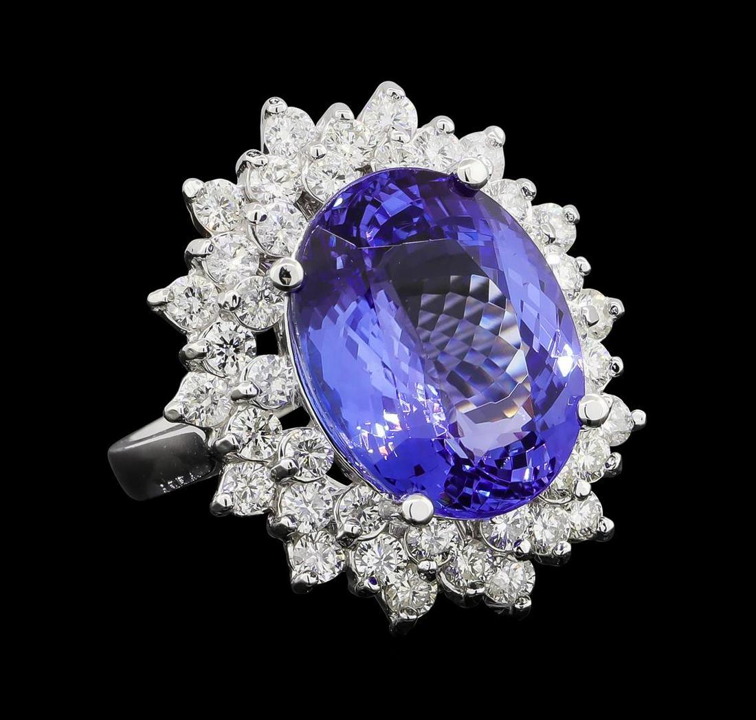 GIA Cert 11.27 ctw Tanzanite and Diamond Ring - 14KT White Gold: One electronically tested 14KT white gold lady's cast fashion ring with a triple basket halo with a bright polish finish. The featured lady's ring has a shank measuring 2.61 millimeters wide. Identifi