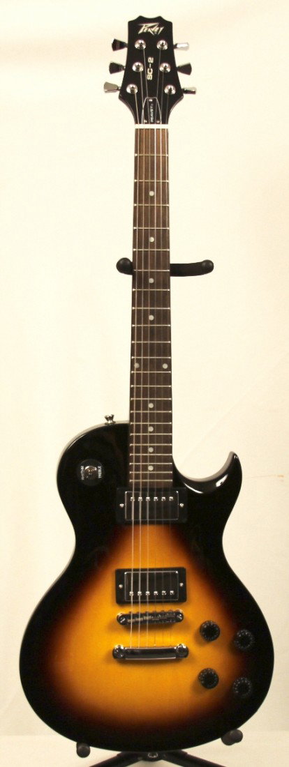 Peavy SC-2 Les Paul Electric Guitar MGUI14: "Peavy SC-2 Les Paul Electric Guitar MGUI14. Excellent Condition! SP141BR. This Peavy HP SC-2 Les Paul type electric guitar boasts humbucking pickups which are ceramic loaded for warmth, punch and pre