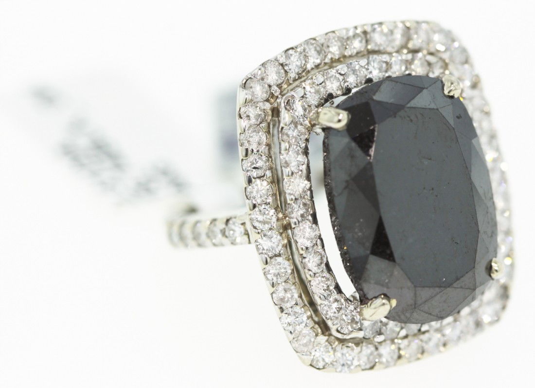 14KT White Gold 21.25ct Black and White Diamond Ring RM: "14KT White Gold 21.25ct Black and White Diamond Ring RM107. Excellent Condition! BT6454WH. One electronically tested 14KT white gold ladies cast black and white diamond ring. Good workmanship. The fe