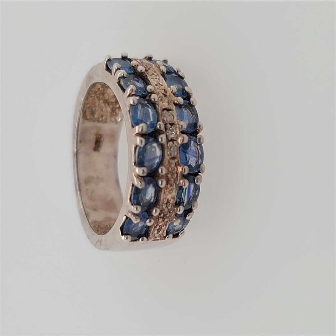Sterling Silver Ring: One Sterling Silver Ring. The ring size is 7. Contains semiprecious stones.