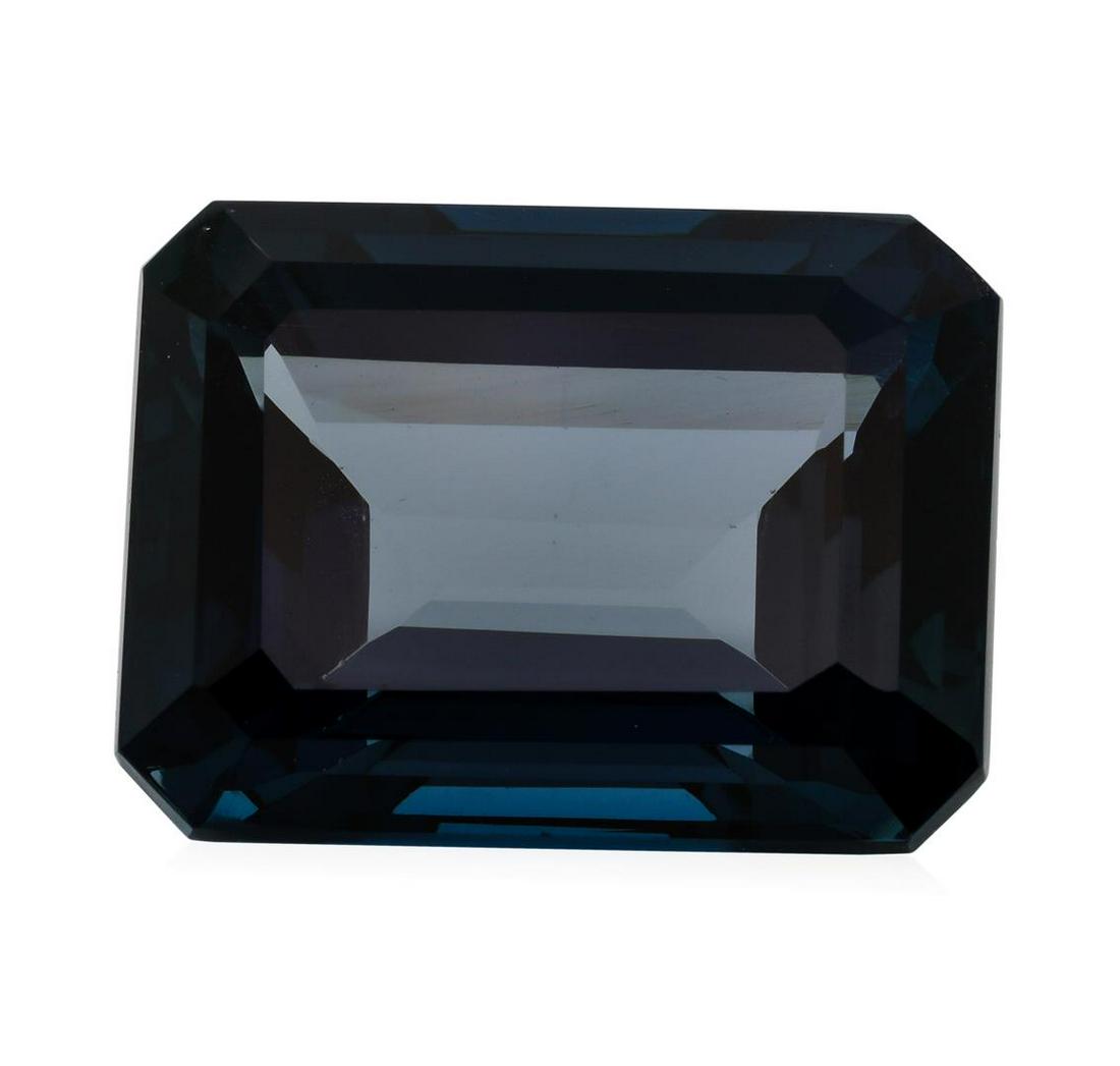 34.21 ct. Natural Emerald Cut London Blue Topaz: One natural emerald cut london blue topaz with an exact weight of 34.21ct., clarity is eye clean, greenish blue, medium dark. Gemological Appraisals Services estimates the retail value at $684.2 GAS A