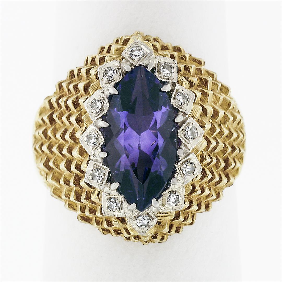 Vintage 18k Gold 1.76 ctw Marquise Amethyst & Round Diamond Halo Textured Ring: A solid 18k yellow gold textured ring, with 1 marquise cut natural amethyst (1.60ct ), surrounded with a halo of 12 round single cut natural diamonds (F/G - VS1/VS2 ; 0.16ctw). The ring is size 6.5, w
