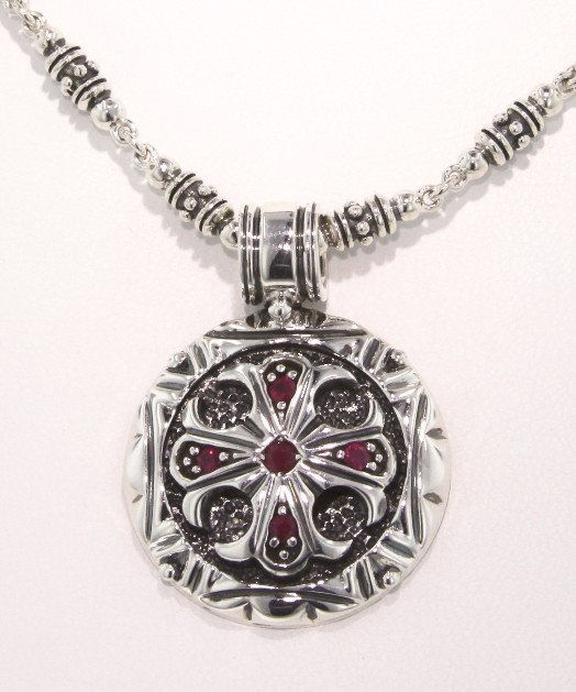 Polished Sterling Silver and Ruby Round Cross Pendant G: "Polished Sterling Silver and Ruby Round Cross Pendant GD297. Excellent Condition! YW142GD. One polished sterling silver and ruby round cross pendant with chain. Ends in a toggle clasp. Chain measures