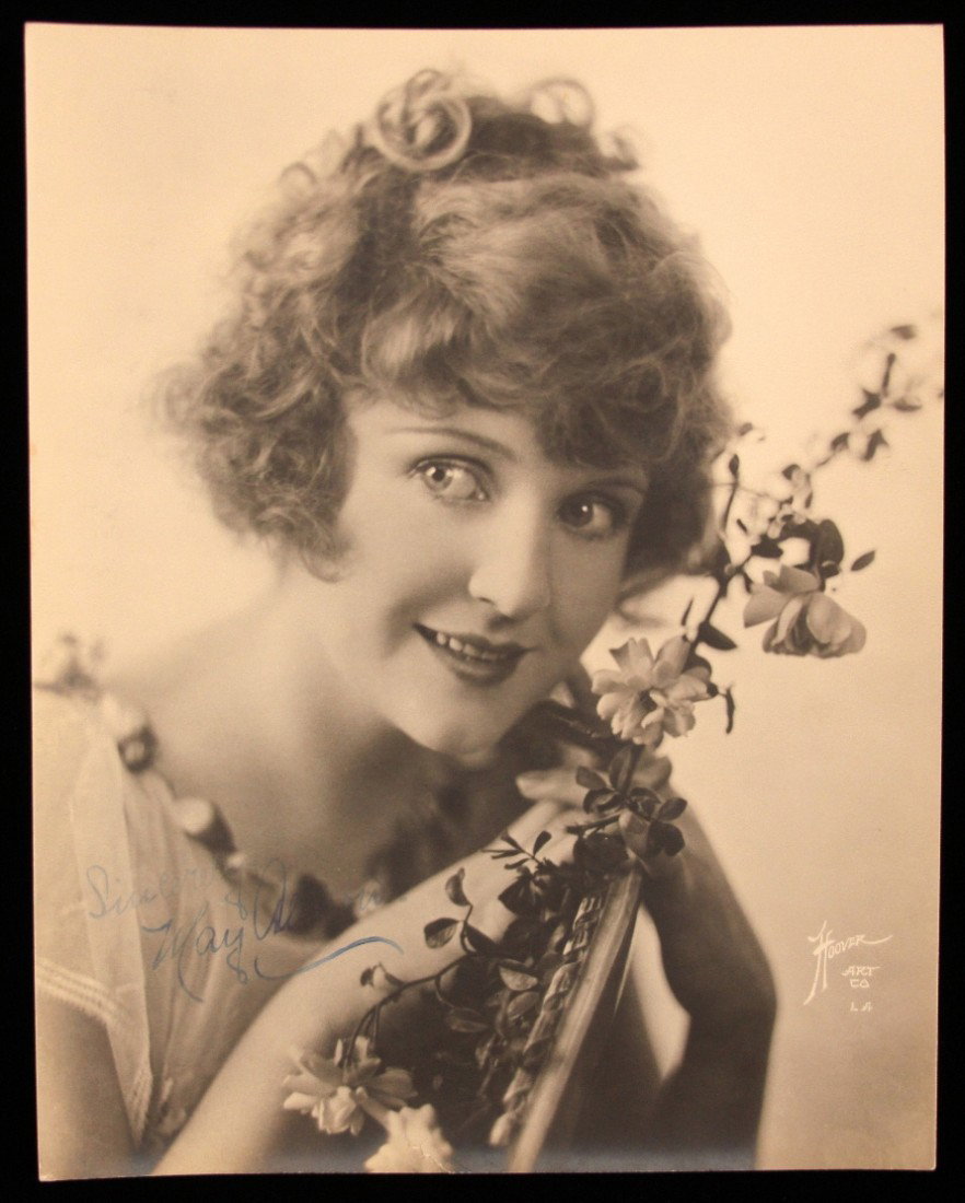 Authentic May Allison Signed Photo ED1131: "Authentic May Allison Signed Photo ED1131. Excellent Condition! KA101ER. Black and white with sepia-toned publicity photo of Allison from the shoulders up in a light-colored blouse with a swag of flo