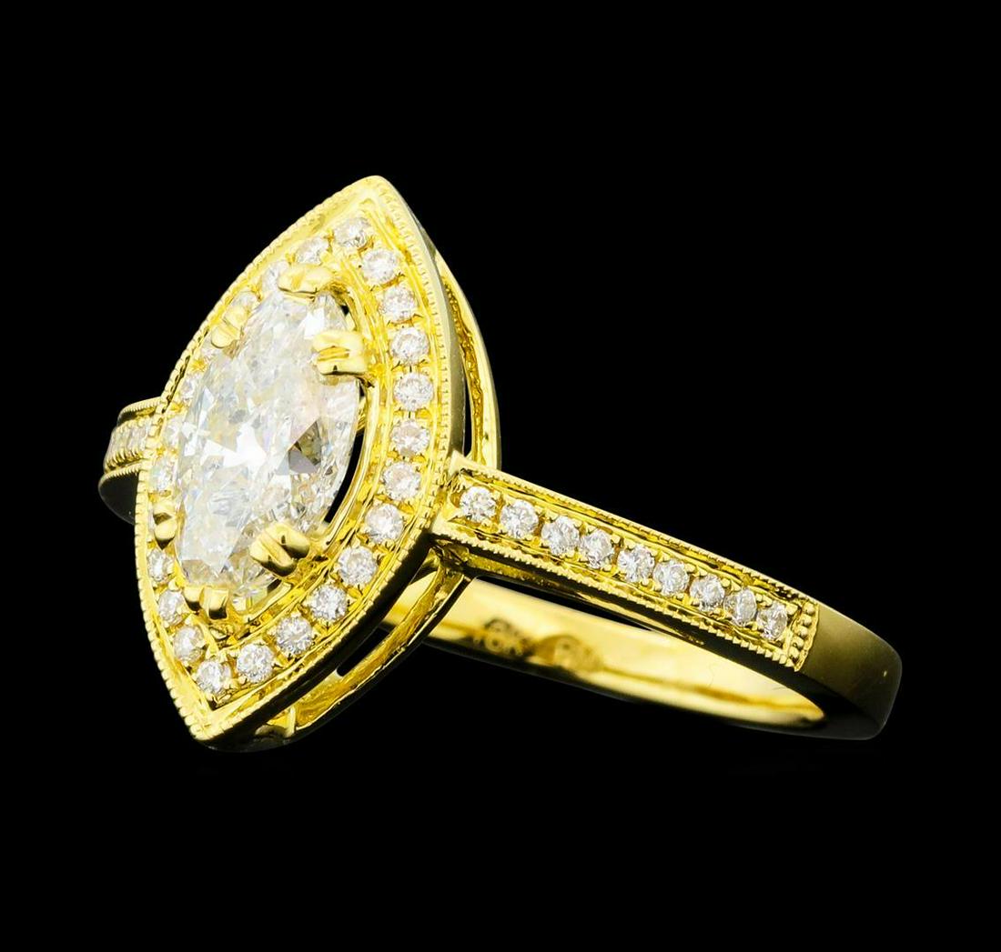 1.20 ctw Diamond Ring - 18KT Yellow Gold: One electronically tested 18KT yellow gold lady's cast wedding ring with a basket halo with cathedral shank with a bright polish with milgrain detailing finish. The featured lady's ring has a shank me