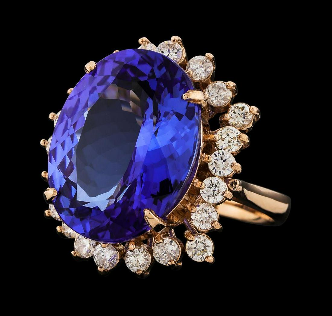 14.54 ctw Tanzanite and Diamond Ring - 14KT Rose Gold: One electronically tested 14KT rose gold lady's cast fashion ring with a staggered basket halo with a bright polish finish. The featured lady's ring has a shank measuring 2.85 millimeters wide. Identi