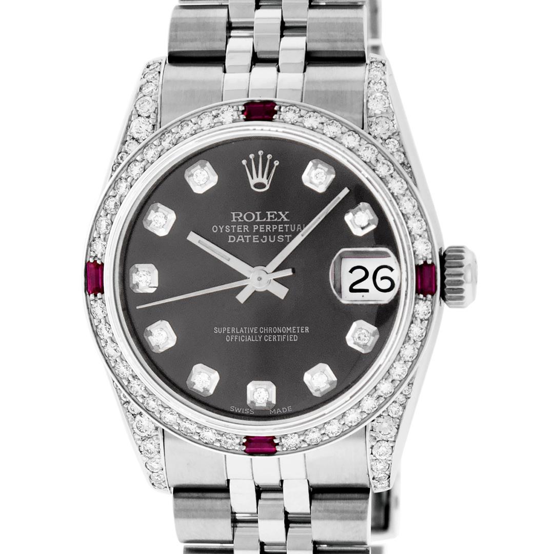 Rolex Womens Midsize 31mm Grey Diamond Lugs & Ruby Datejust Wristwatch: One Womens Pre Owned Midsize Stainless Steel Rolex Datejust Polished, Serviced & Electronically Tested, Stainless Steel Case Case: 31mm, Stainless Steel Crown, Custom Diamond Lugs: 24 Diamonds On Lugs