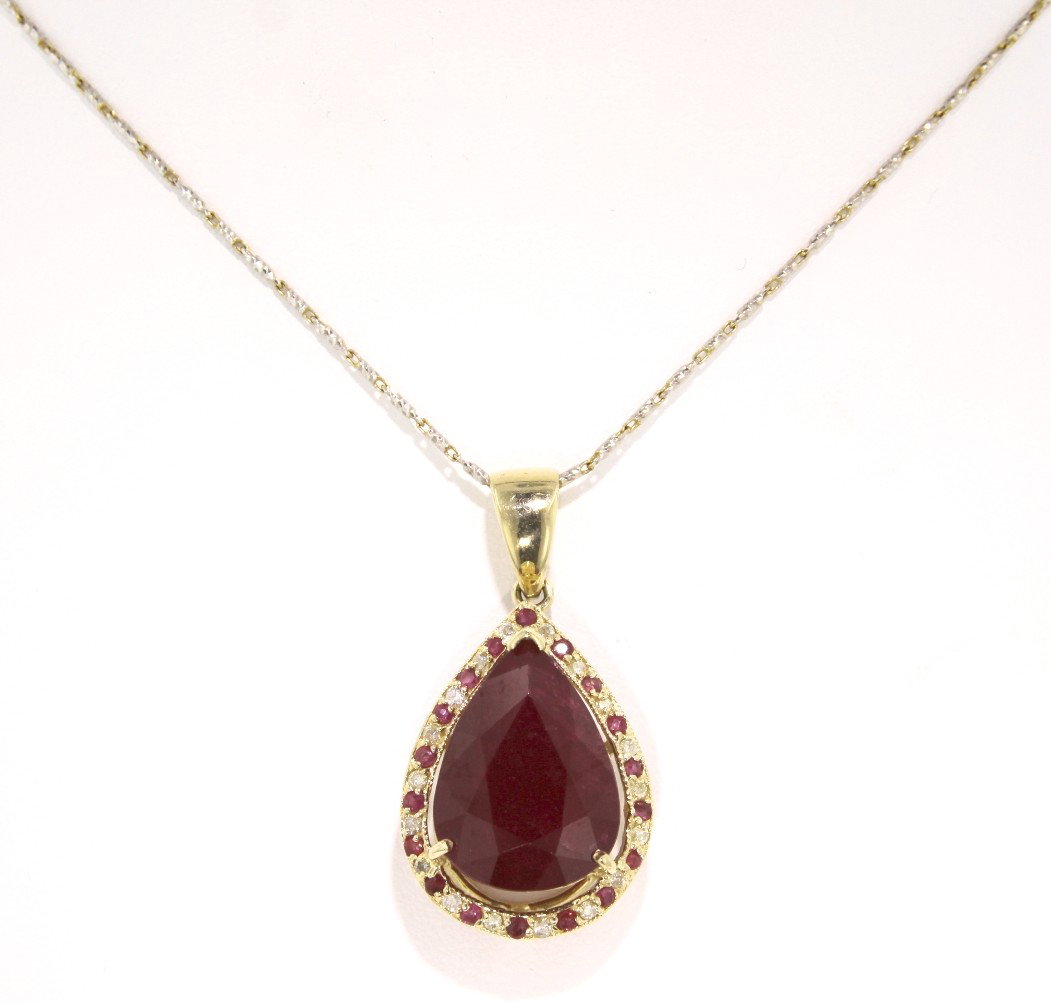 14KT Yellow Gold 17.75ct Ruby and Diamond Pendant and C: 14KT Yellow Gold 17.75ct Ruby and Diamond Pendant and Chain RM144. Excellent Condition! FT8101US. One electronically tested 14KT yellow gold ladies cast and assembled ruby and diamond pendant with cha